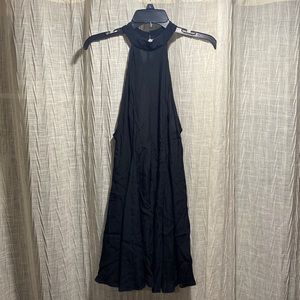 Black halter top dress with open back fit to flare
